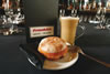 Krispy Kreme doughnut at a cafe, with a coffee