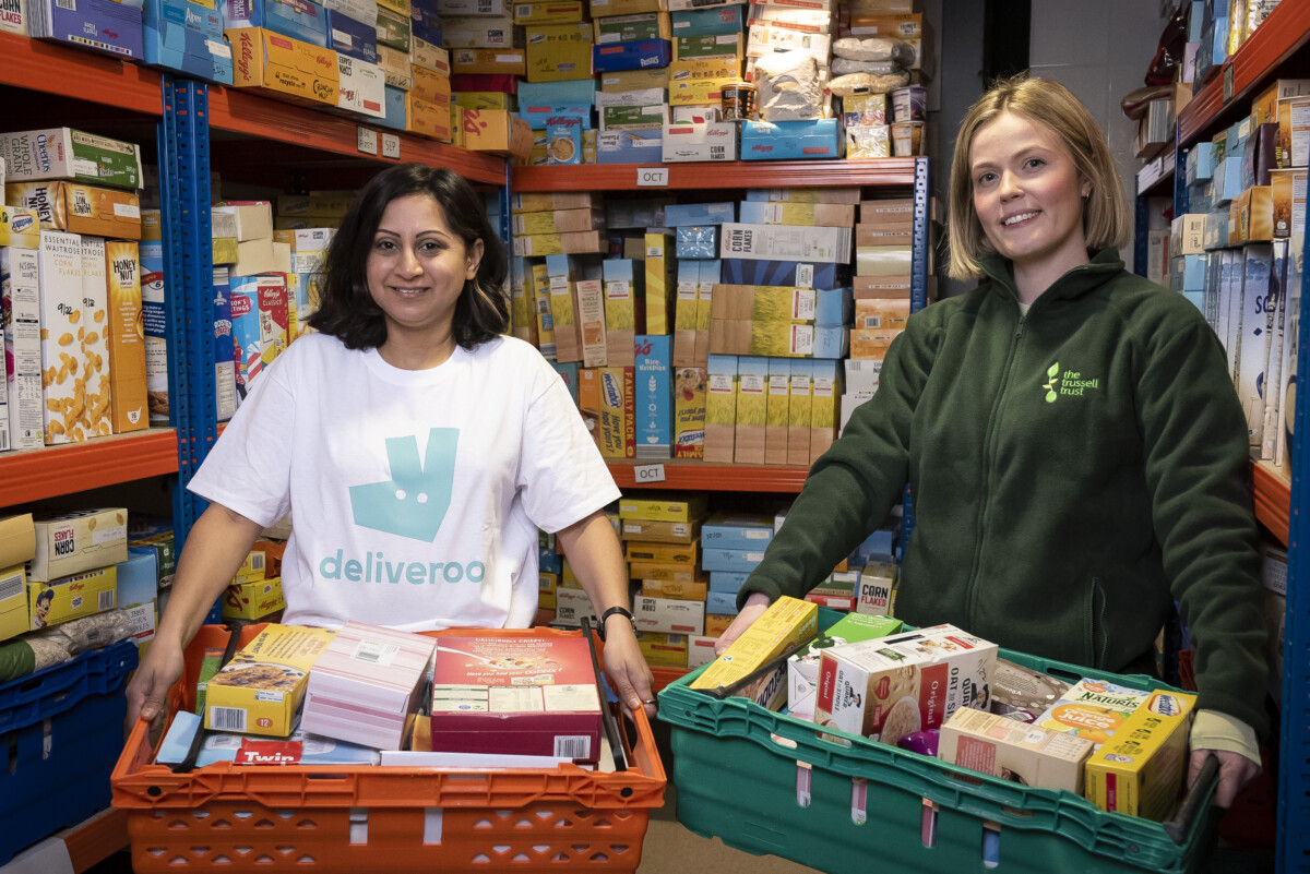 Deliveroo staff delivering meals to a food bank