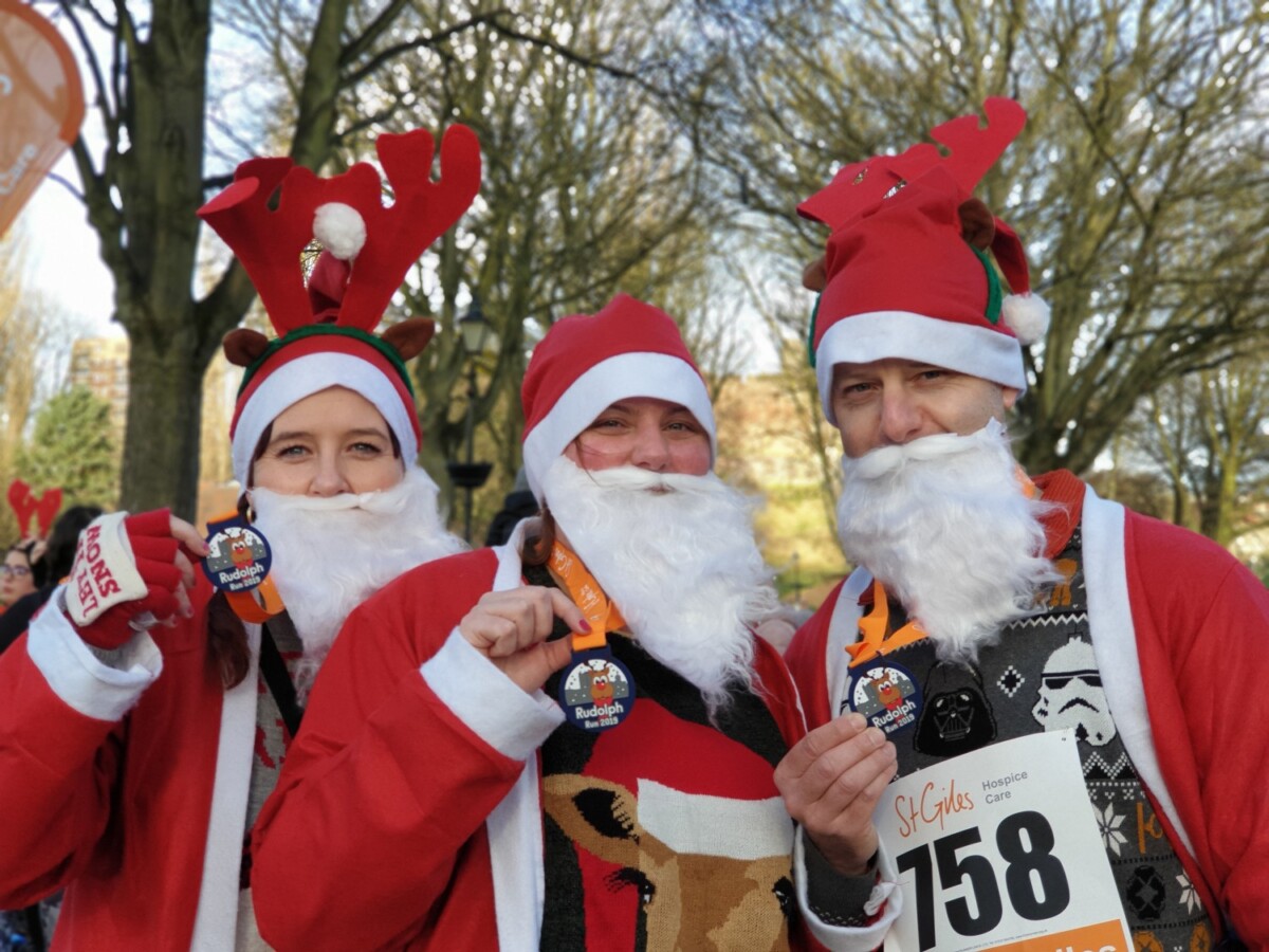 A group of people dressed up as santa