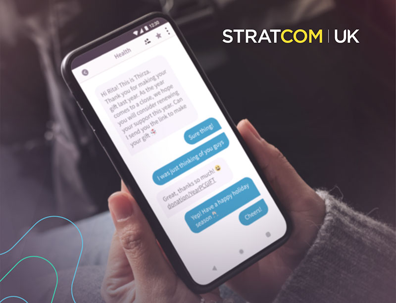 Messaging on a mobile phone, with Stratcom UK logo