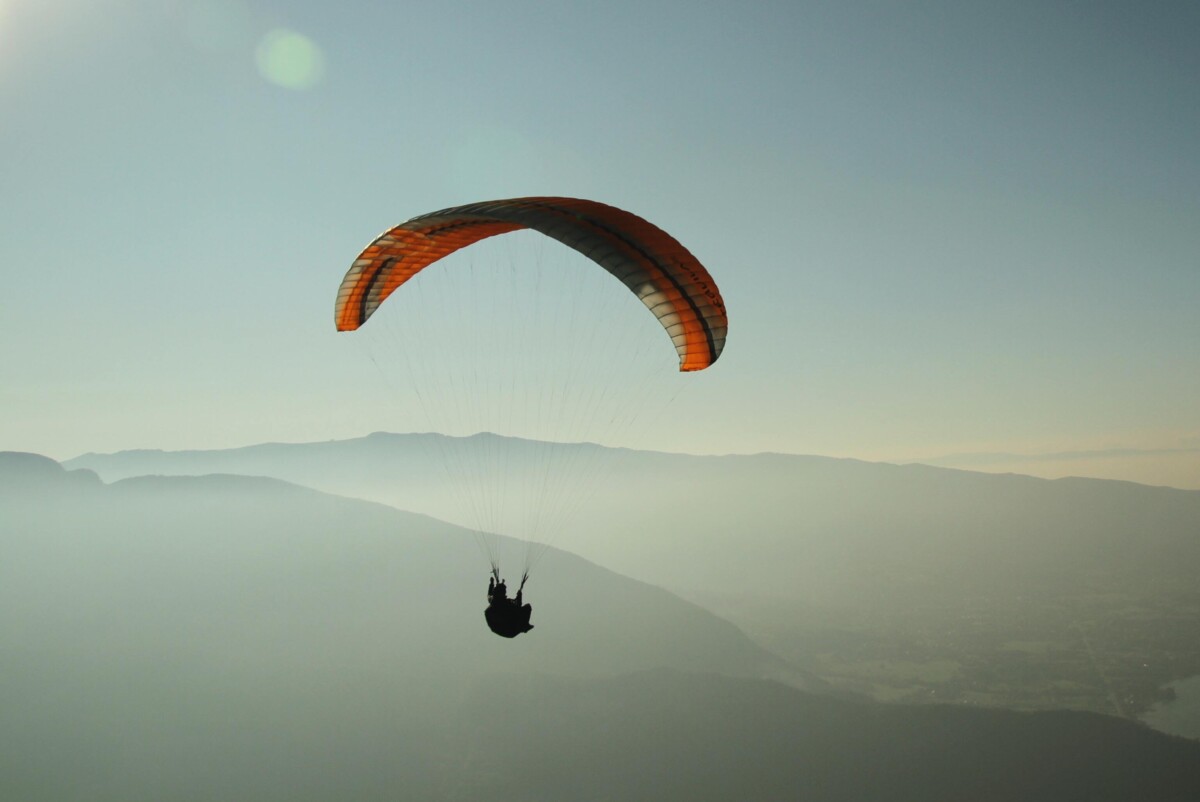 A parachute in a sunlit sky. By Jahoo Clouseau on Pexels
