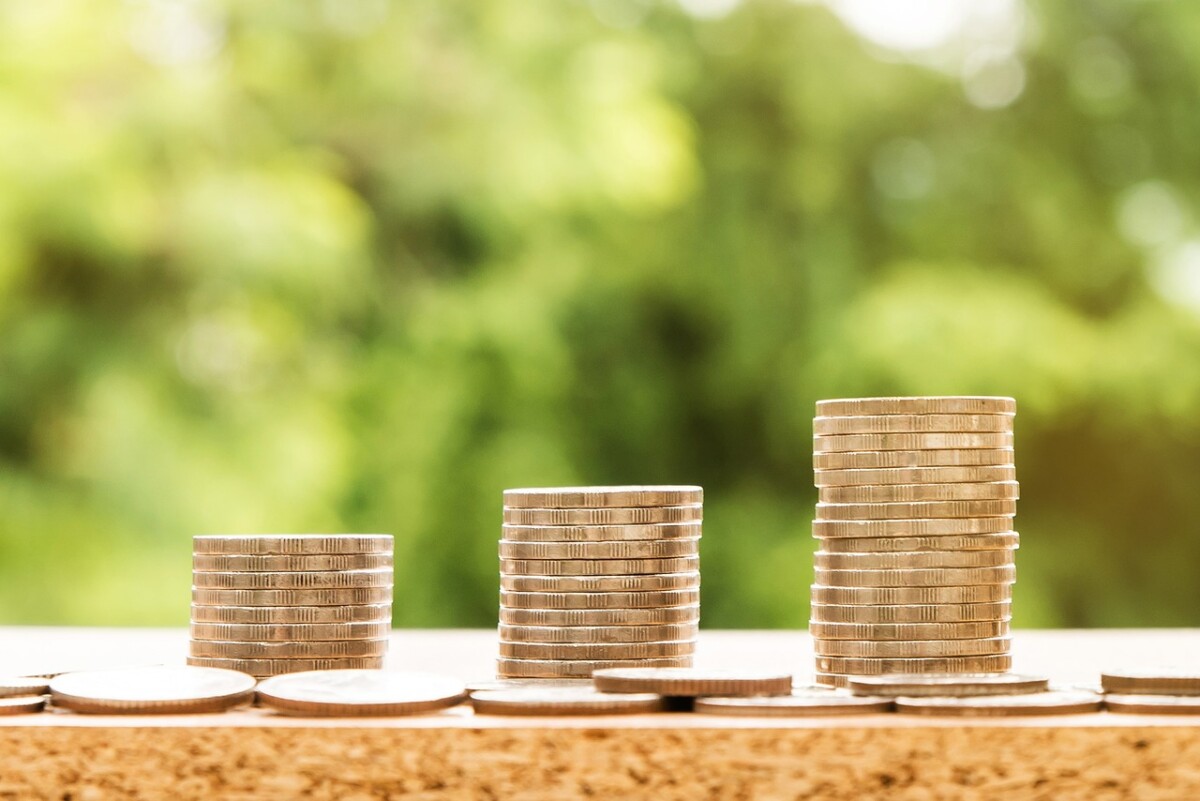 three small towers of coins each one bigger than the next