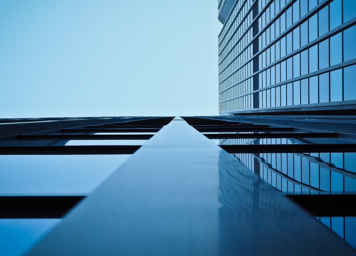 a low angle shot of skyscrapers. by pixbay on pexels
